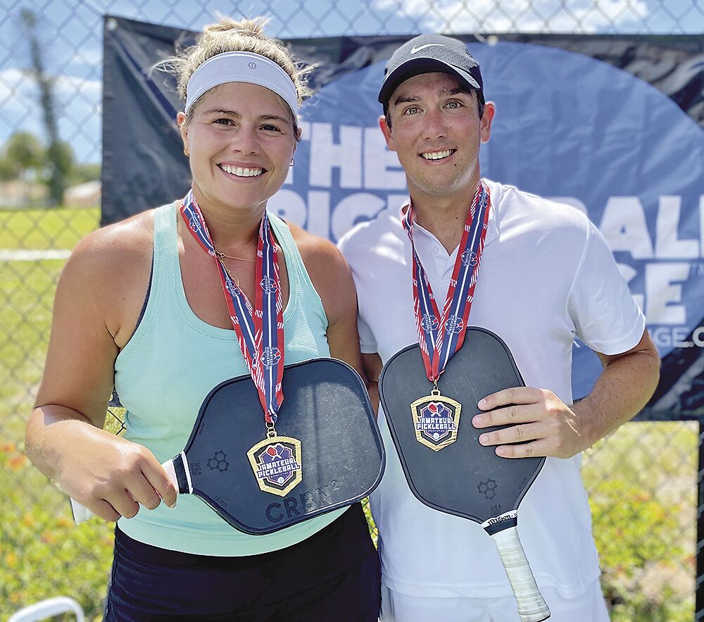 10. Erica Frank and Robert Vaughn won the 4.0 mixed double championship..tif